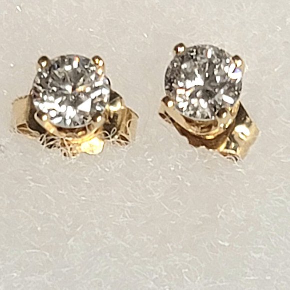 None Jewelry - Vintage Round Cut 1/8 Carat Diamond Earrings Set in Gold Posts.